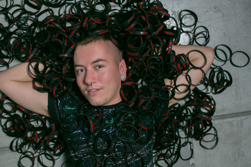 Performer James Darling, and Stop 60 bracelets 